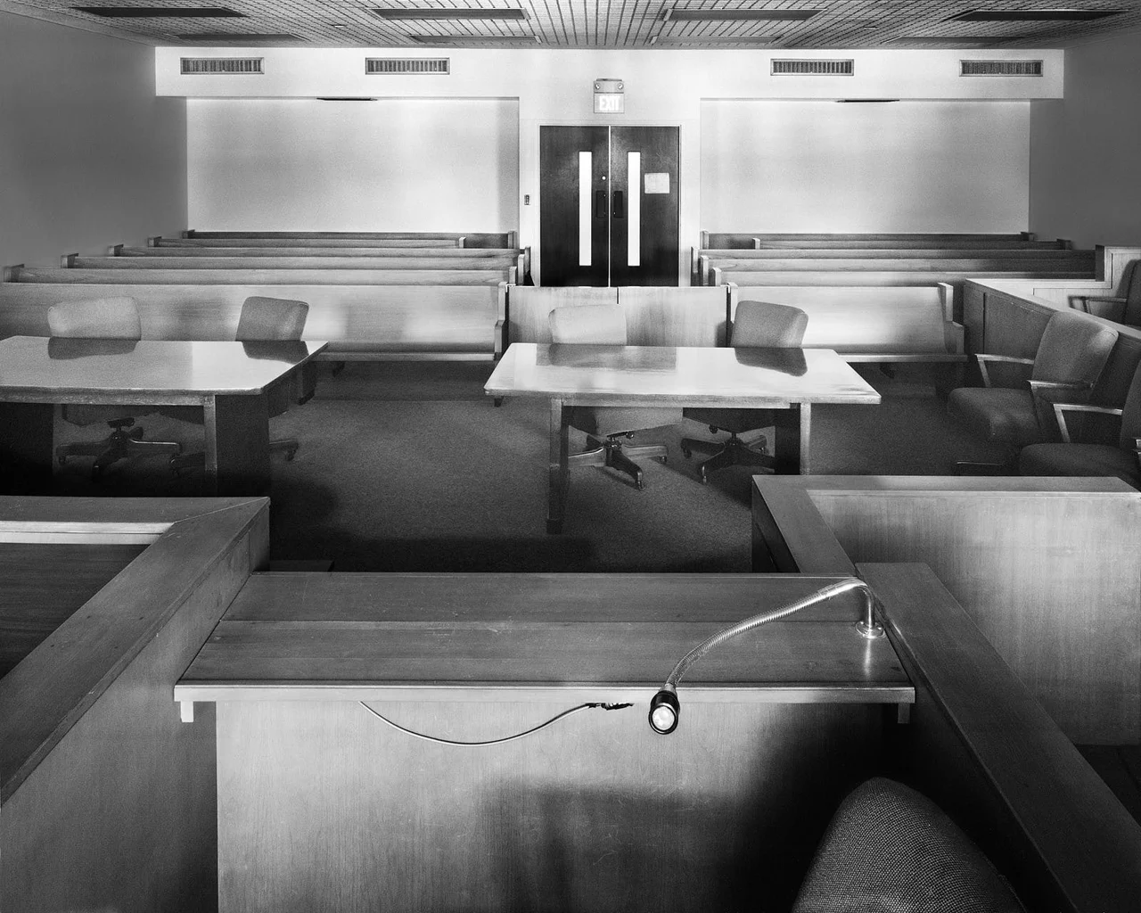 Black and white photograph of a large courtroom in Cedar County, Iowa
