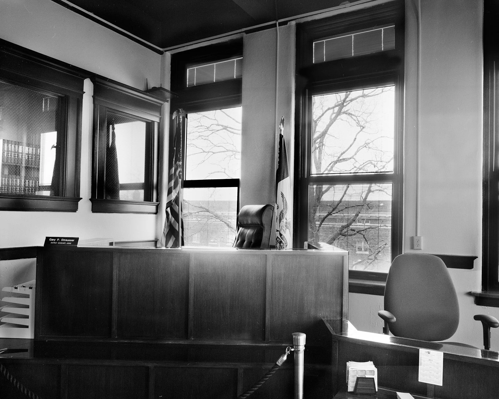Black and white photograph of a small courtroom in Muscatine County, Iowa